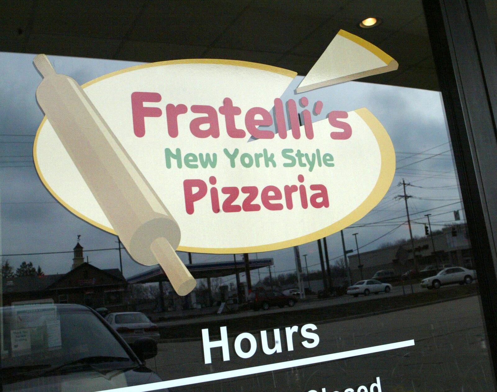 Fratelli's Pizzeria at the corner of Tylersville and Cin-Day Road in West Chester specilizes in New York-style, thin crust pizza. Staff photo by Linda Weisenborn   