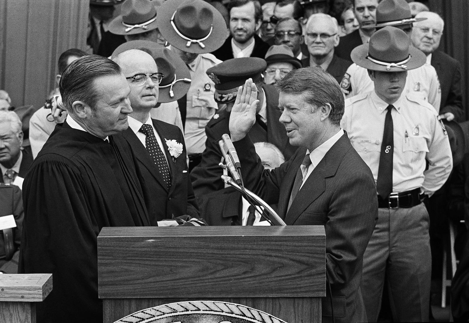 FILE - Judge Robert H. Jordan administers the oath of office to Gov. Jimmy Carter at the Georgia Capitol in Atlanta, Jan. 12, 1971. Next to the judge is former Gov. Lester Maddox, who will take over as lieutenant governor of Georgia. (AP Photo, File)