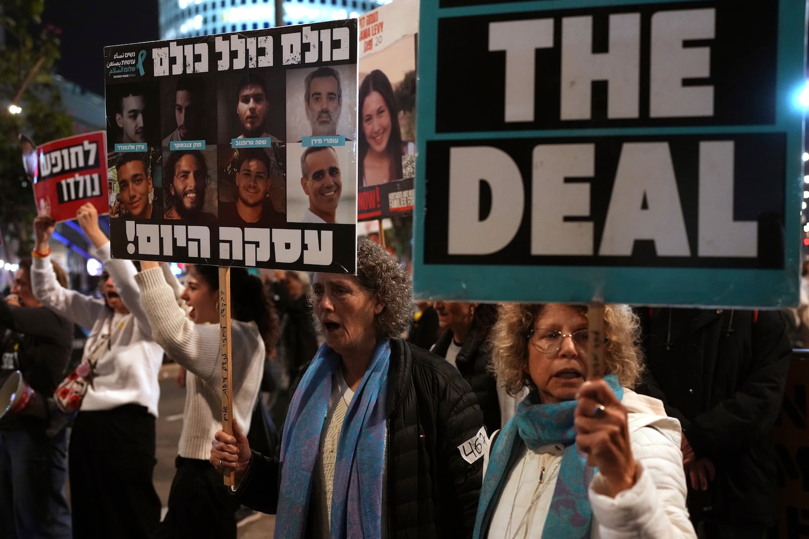 Relatives and friends of people killed and abducted by Hamas and taken into Gaza, take part in a demonstration in Tel Aviv, Israel, Wednesday, Jan. 15, 2025. (AP Photo/Ohad Zwigenberg)