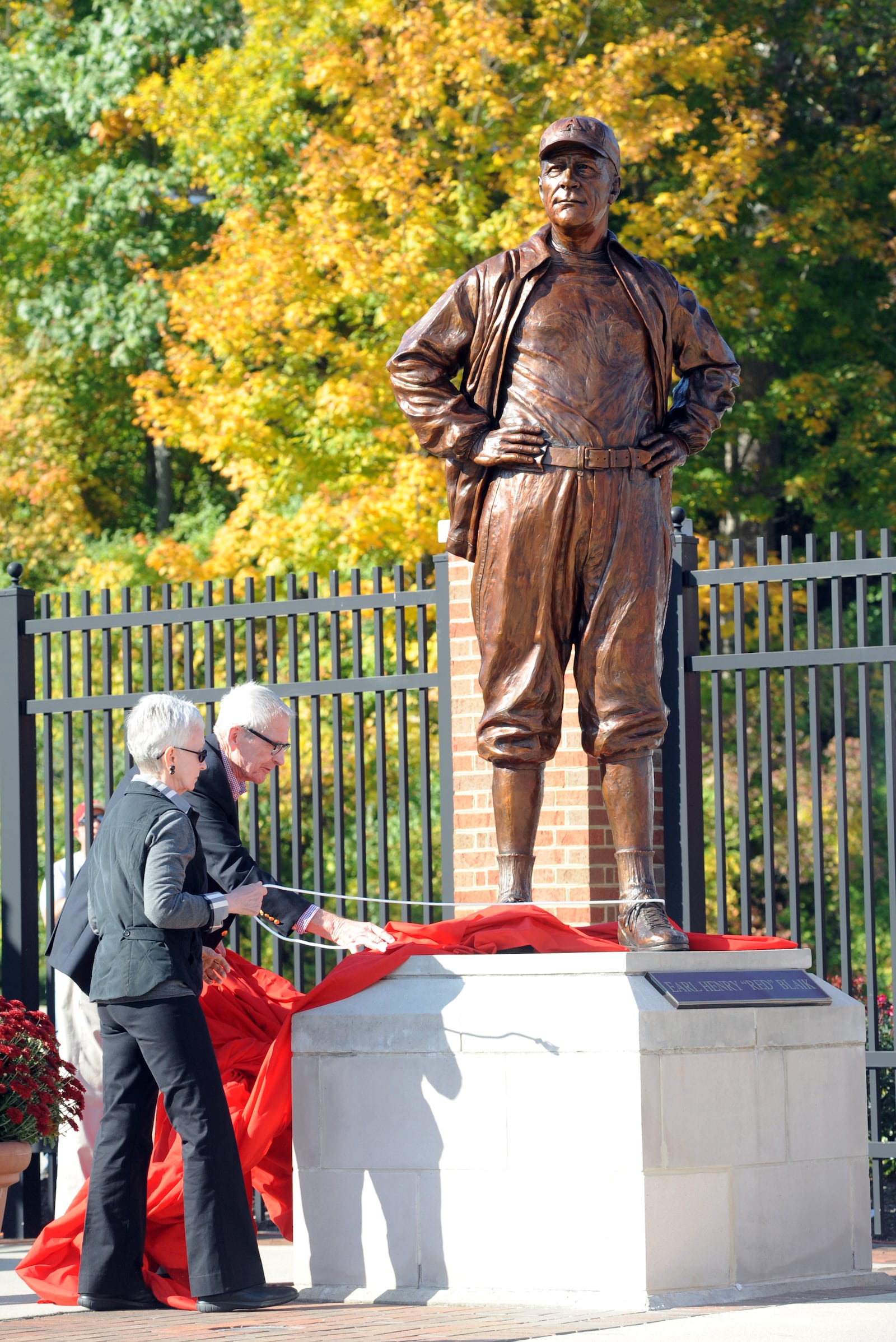 Bob and Dorothy Blaik unveil the statue for Earl Blaik during a ceremony for the Cradle of Coaches before Miami University's football game against Army on Saturday, Oct. 8, 2011 at Yager Stadium in Oxford. Staff photo by Samantha Grier. 