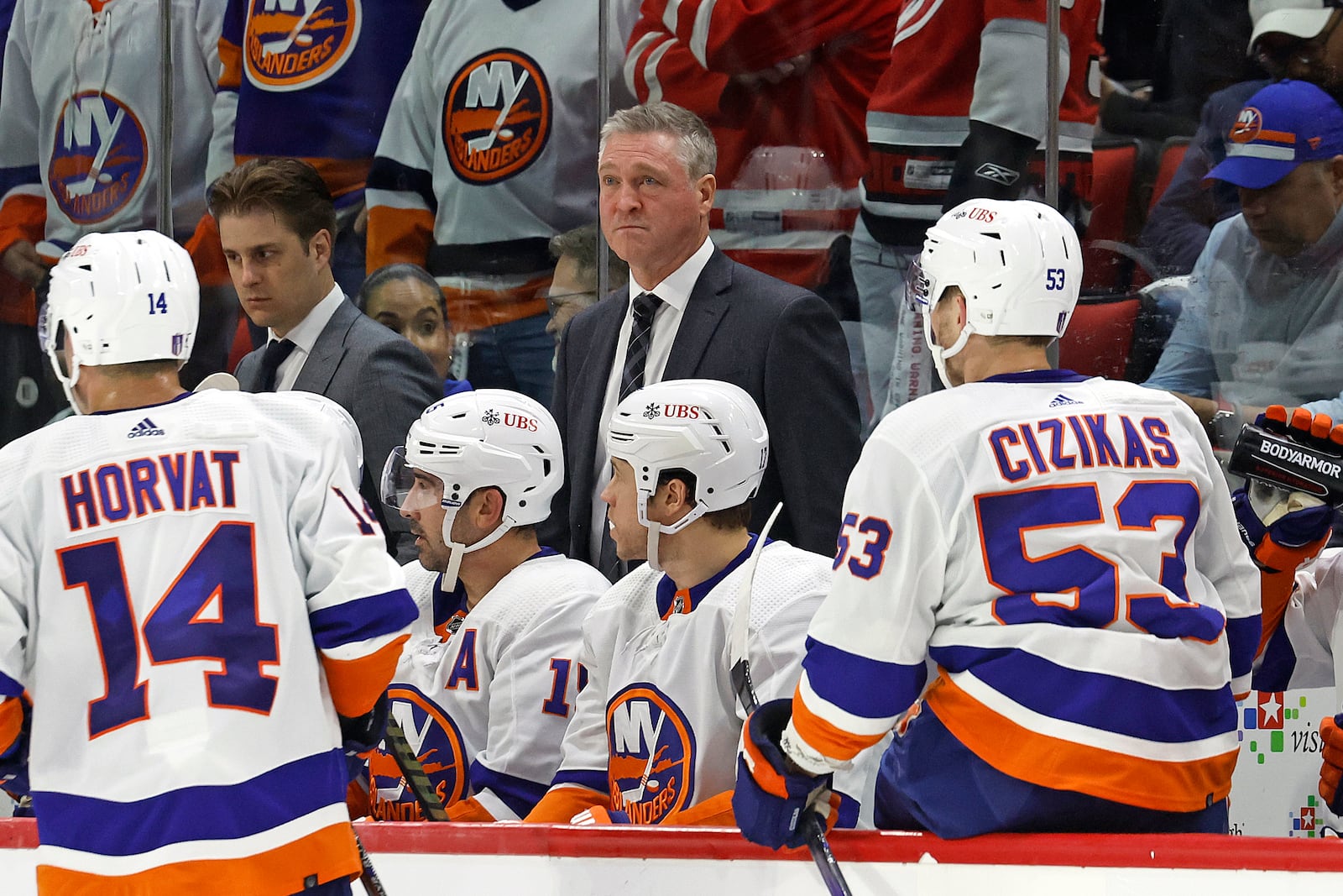 FILE - New York Islanders head coach Patrick Roy stands behind the bench during Game 2 of an NHL hockey Stanley Cup first-round playoff series against the Carolina Hurricanes in Raleigh, N.C., April 22, 2024. (AP Photo/Karl B DeBlaker, File)