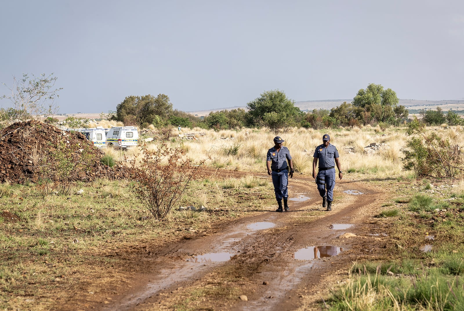 Police patrol at a mine shaft where an estimated 4000 illegal miners are trapped in a disused mine in Stilfontein, South Africa, Wednesday, Nov.13, 2024. (AP Photo)