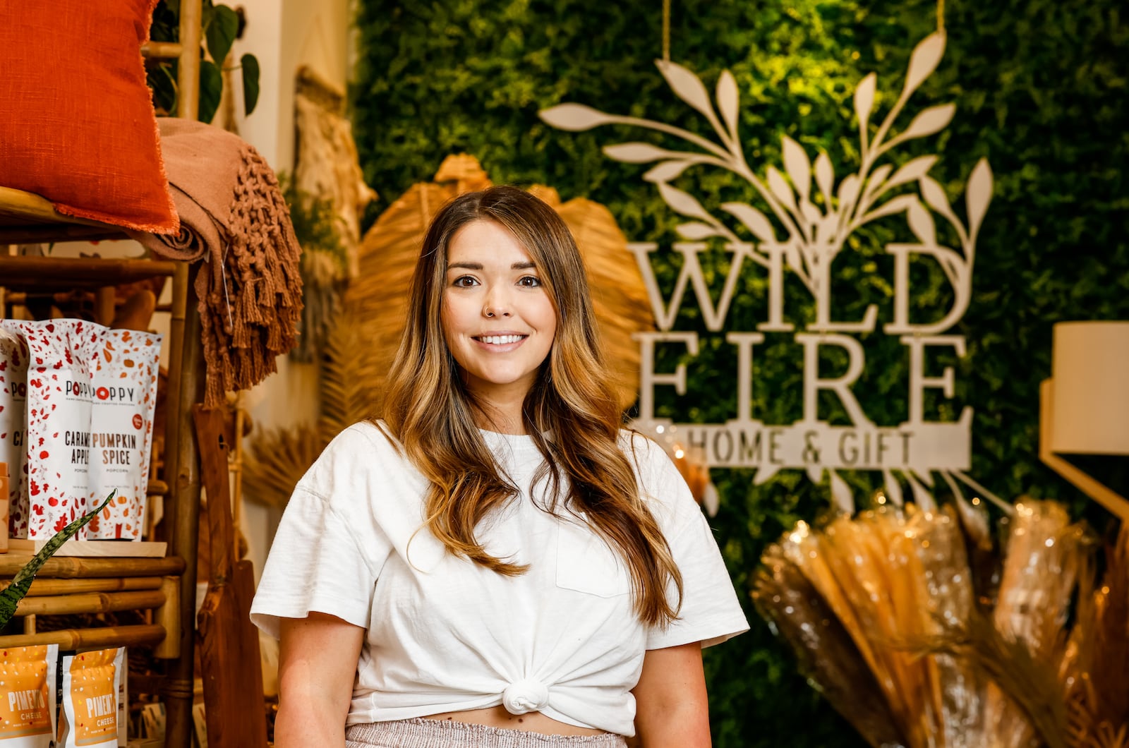 Sarah Dankhoff, owner of Wildfire Hygge Goods, stands in her shop Thursday, Sept. 16, 2021 on High Street in Hamilton. The shop has been in operation for two years and they have recently purchased a building on N. 2nd Street they are renovating to expand the business. NICK GRAHAM / STAFF