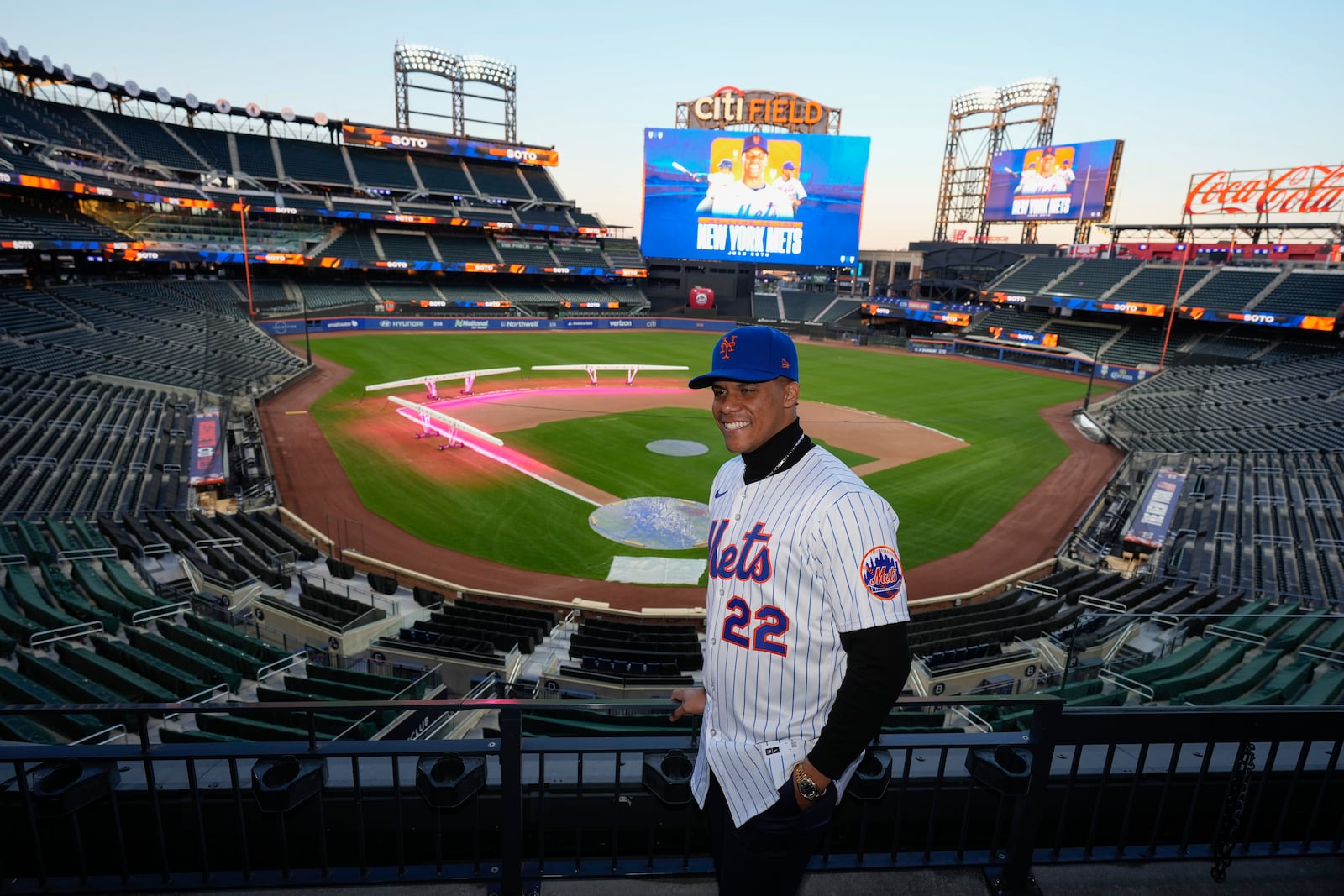 New York Mets' Juan Soto poses for photographs at Citi Field, Thursday, Dec. 12, 2024, in New York. (AP Photo/Frank Franklin II)