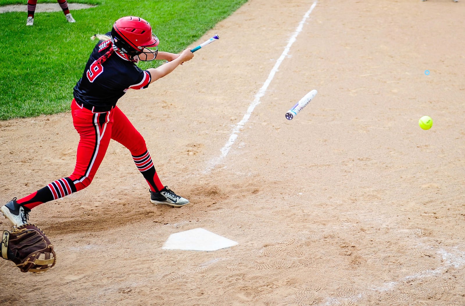 Lakota West's Alyssa Triner breaks her bat during a Division I regional semifinal Wednesday against Lebanon at Centerville. NICK GRAHAM/STAFF