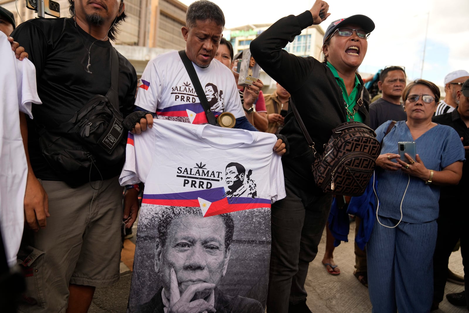 Supporters rally outside Villamor Air Base after former President Rodrigo Duterte was arrested, Tuesday, March 11, 2025, near Manila, Philippines. (AP Photo/Aaron Favila)