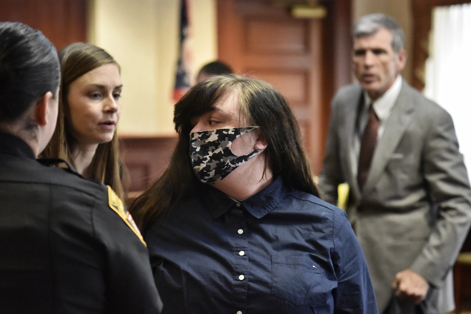 Aerial Brazzell, with attorneys, Kara Blackney, left, and Bill Gallagher, pleaded guilty to reckless homicide in the shooting death of J.R. Boggs Thursday, June 10, 2021 in Butler County Common Pleas Court in Hamilton. NICK GRAHAM / STAFF