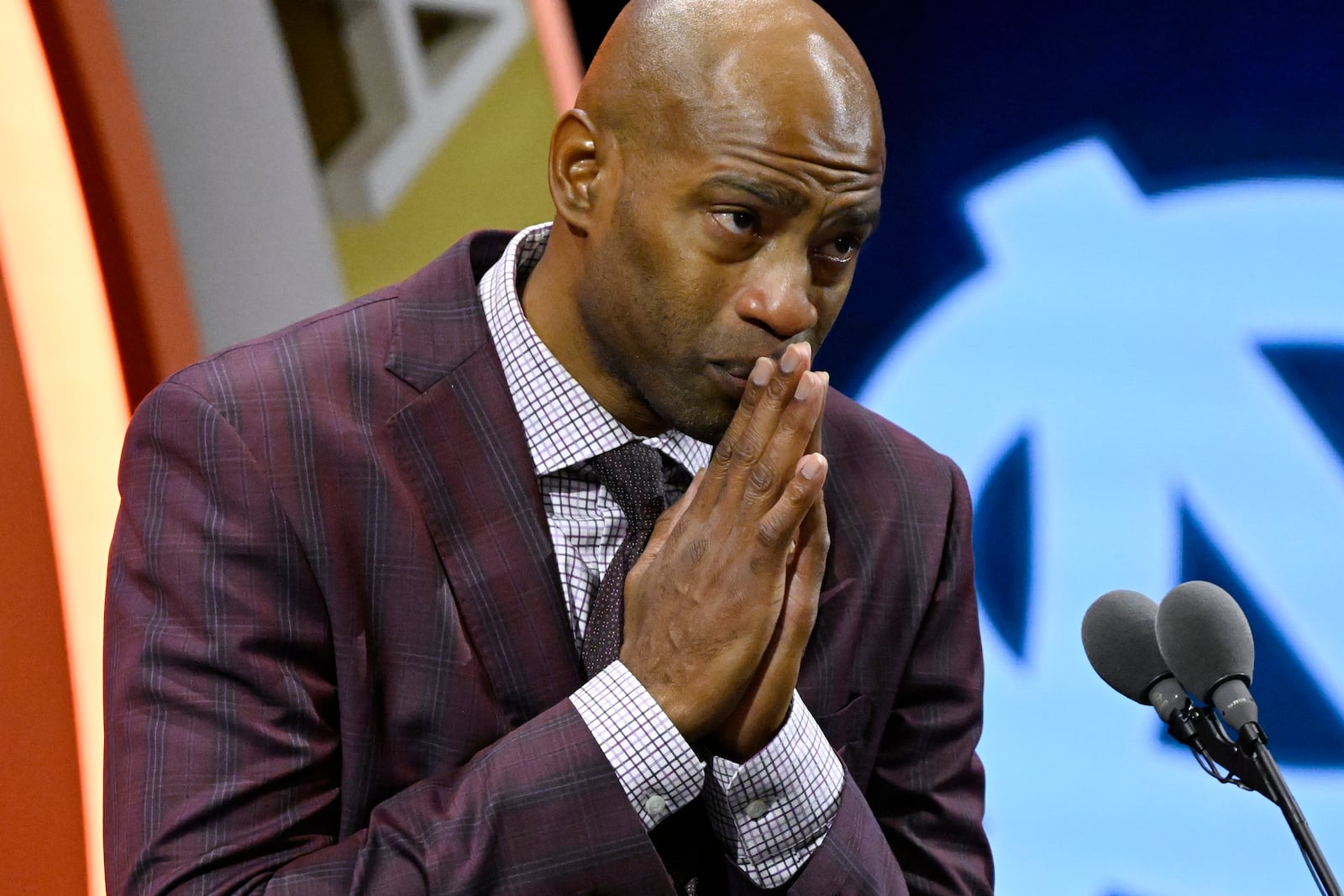 Vince Carter reacts while talking about his mother during his enshrinement in the Basketball Hall of Fame, Sunday Oct. 13, 2024, in Springfield, Mass. (AP Photo/Jessica Hill)