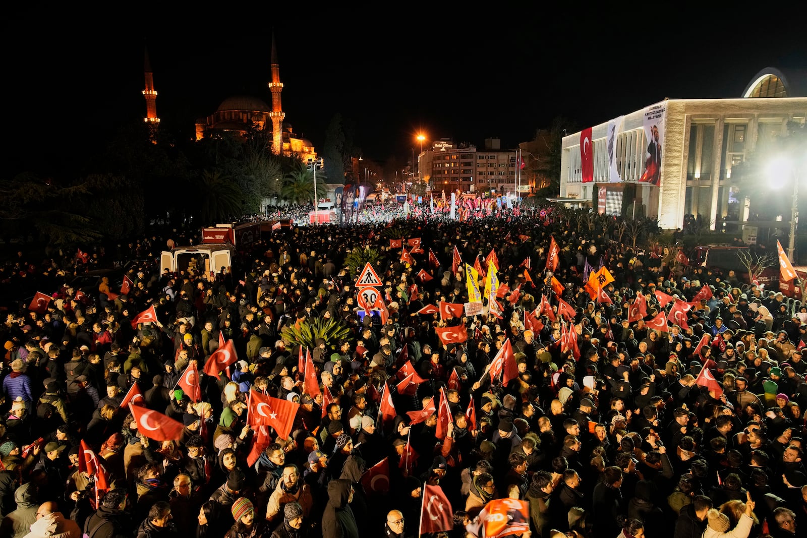 People gather outside the City Hall to protest the arrest of Istanbul Mayor Ekrem Imamoglu in Istanbul, Turkey, Wednesday, March 19, 2025. (AP Photo/Emrah Gurel)