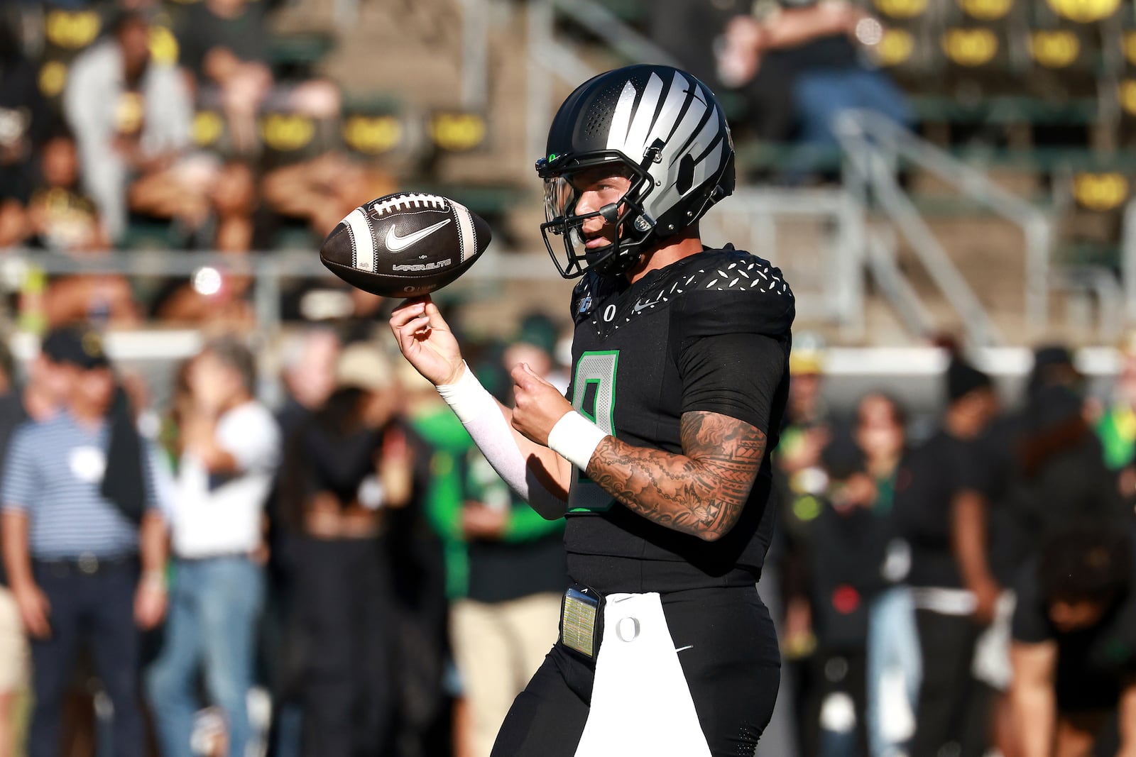 Oregon quarterback Dillon Gabriel warms up before an NCAA college football game against Ohio State, Saturday, Oct. 12, 2024, in Eugene, Ore. (AP Photo/Lydia Ely)