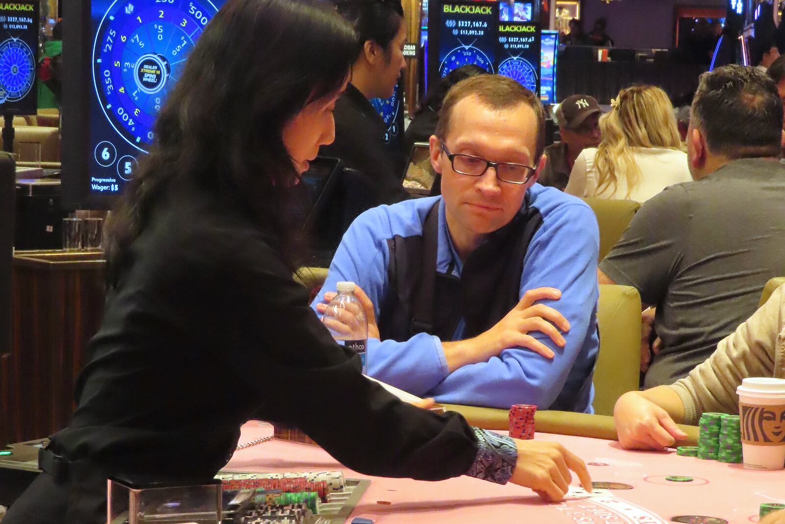 A dealer conducts a card game at the Hard Rock casino in Atlantic City, N.J., on Oct. 3, 2024, a month in which internet gambling set a new revenue record in New Jersey at $213 million. (AP Photo/Wayne Parry)