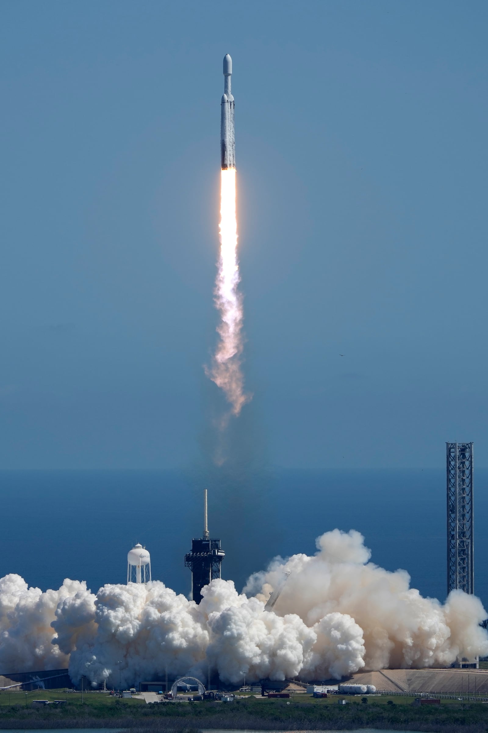 A SpaceX Falcon Heavy rocket with a NASA spacecraft bound for Jupiter lifts off from pad 39A at the Kennedy Space Center Monday, Oct. 14, 2024 in Cape Canaveral, Fla. (AP Photo/John Raoux)