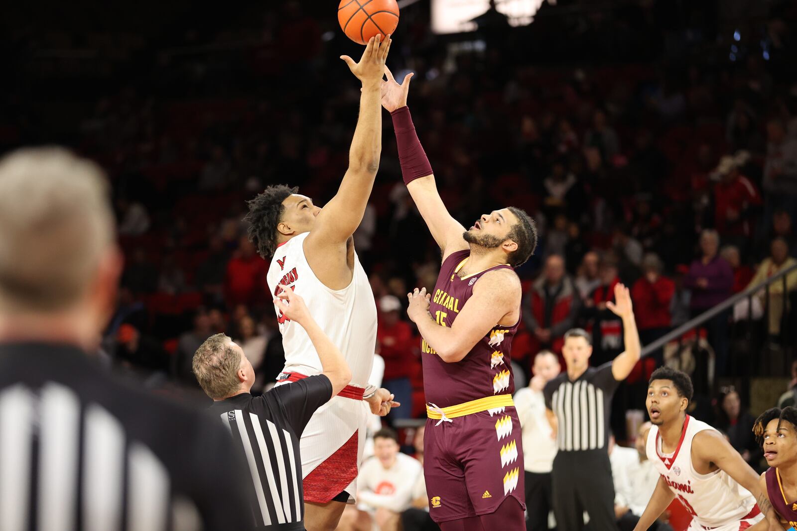 Miami's Anderson Mirambeaux (left) battles for the opening tip during Saturday's game vs. Central Michigan at Millett Hall. Jeff Sabo/Miami Athletics