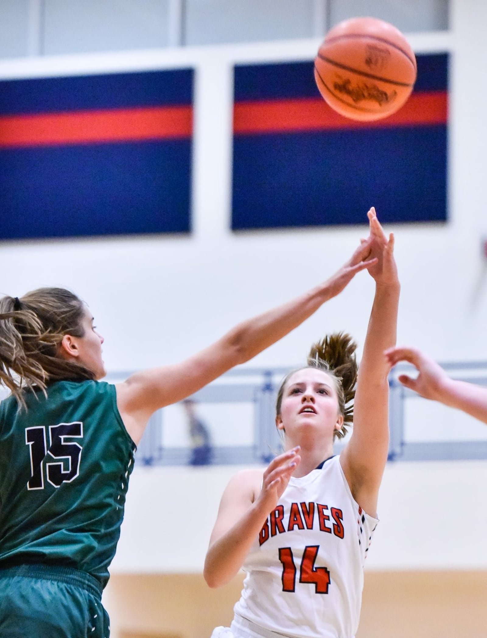 Talawanda’s Addie Brown puts up a shot over Badin’s Grace Larkin during a game Nov. 29, 2017, in Oxford. NICK GRAHAM/STAFF