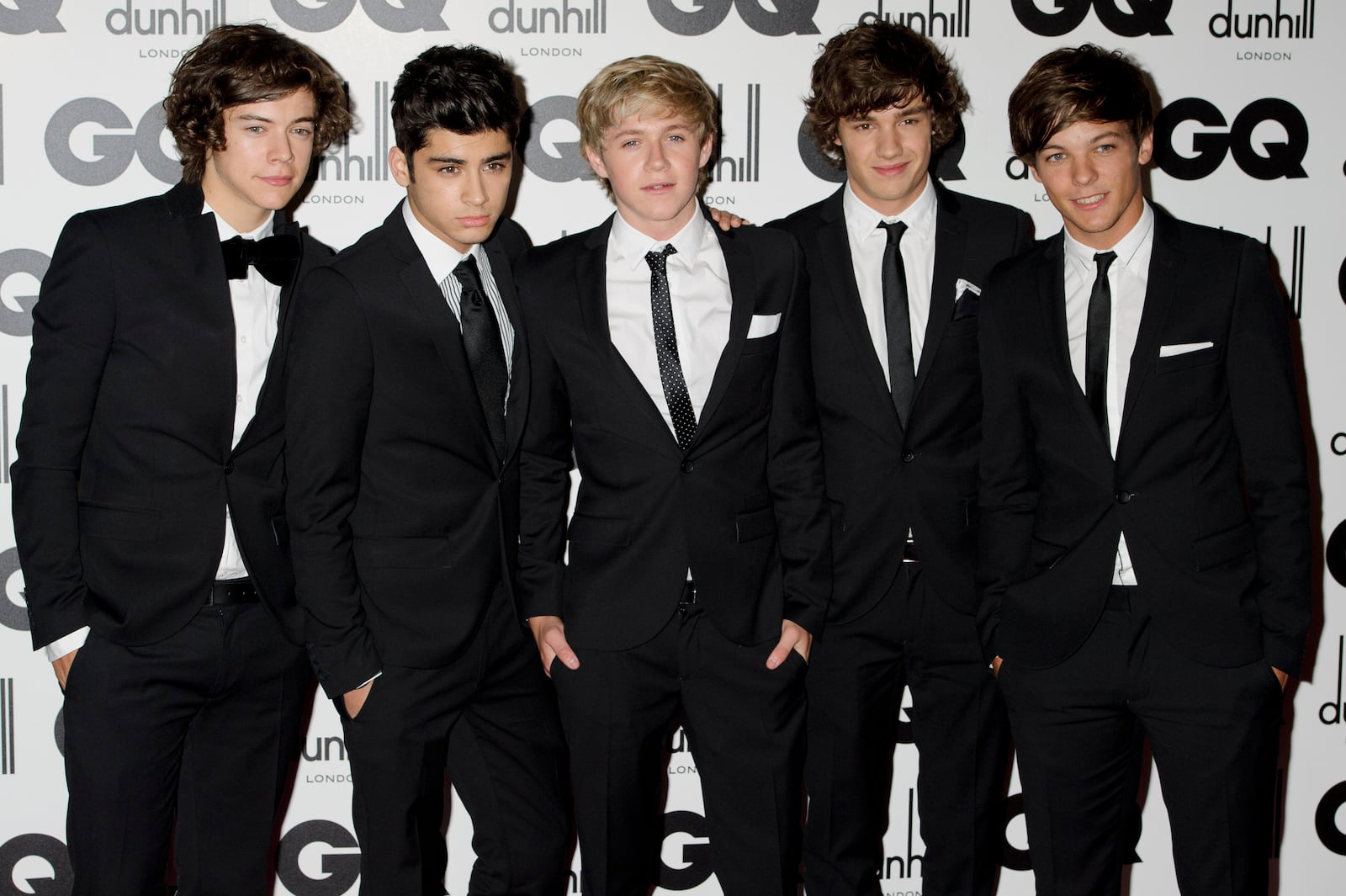 FILE - One Direction's Liam Payne, second from right, poses for a photo with fellow band members Harry Styles, Zayn Malik, Niall Horan and Liam Tomlinson at the GQ Men of the Year Awards in London, Sept. 6, 2011. (AP Photo/Jonathan Short, File)