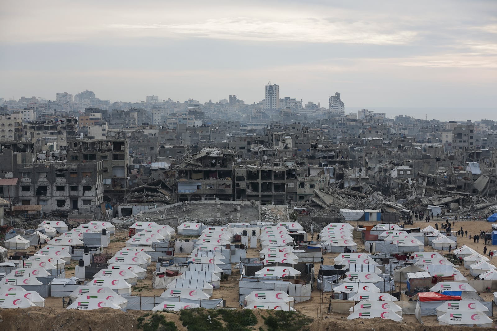 A tent camp for displaced Palestinians is set up amid destroyed buildings in the west of Al-Shati camp, west of Gaza City, on Monday, March 3, 2025. (AP Photo/Jehad Alshrafi)