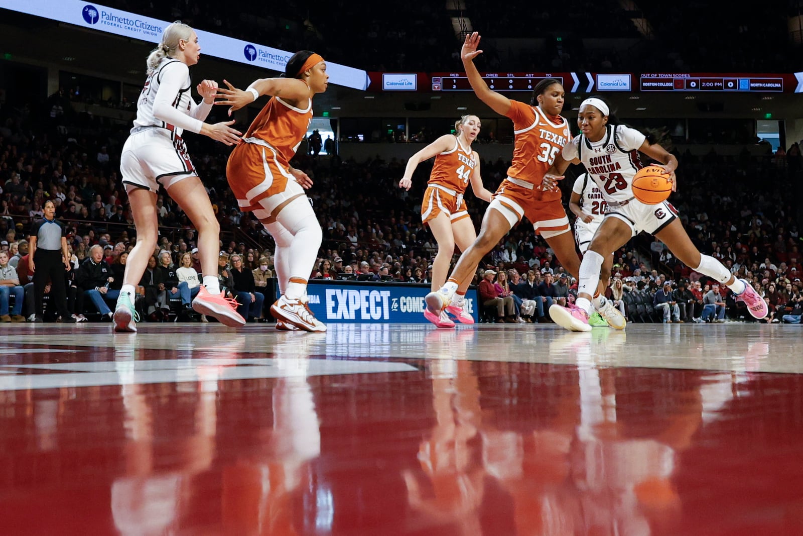 South Carolina guard Bree Hall (23) drives to the basket against Texas forward Madison Booker (35) during the first half of an NCAA college basketball game in Columbia, S.C., Sunday, Jan. 12, 2025. (AP Photo/Nell Redmond)