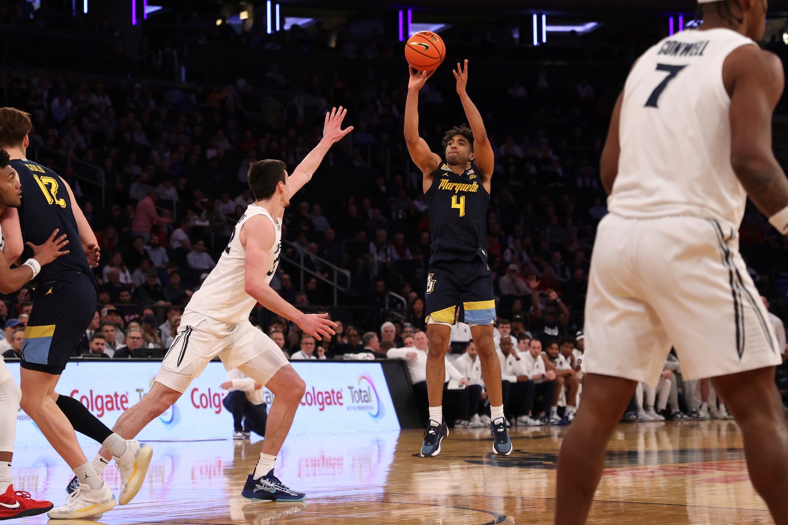 Marquette guard Stevie Mitchell (4) shoots during the second half of an NCAA college basketball game against Xavier in the quarterfinals of the Big East Conference tournament, Thursday, March 13, 2025, in New York. (AP Photo/Pamela Smith)