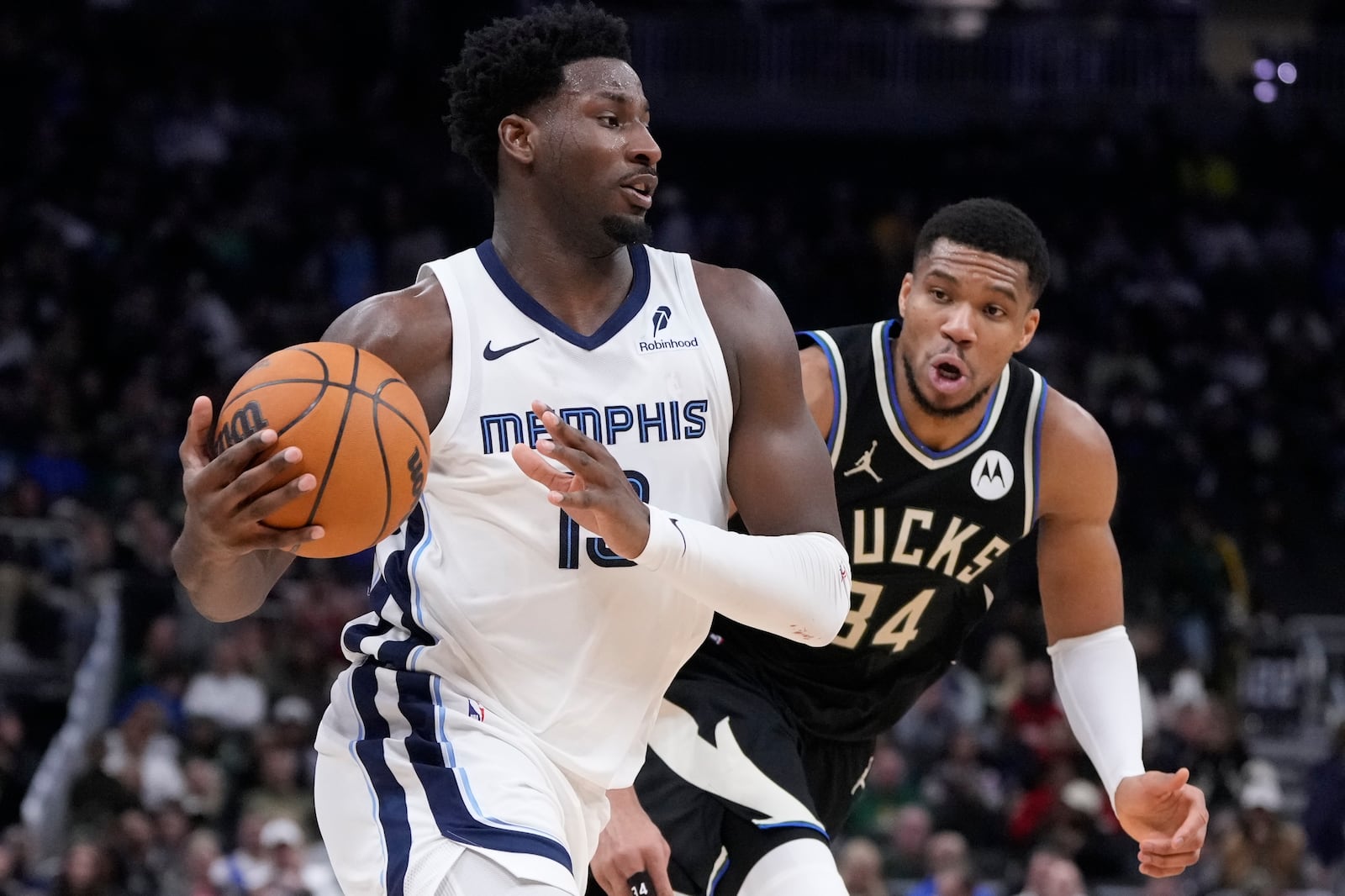 Memphis Grizzlies' Jaren Jackson Jr. drives past Milwaukee Bucks' Giannis Antetokounmpo during the second half of an NBA basketball game Sunday, Feb. 2, 2025, in Milwaukee. (AP Photo/Morry Gash)