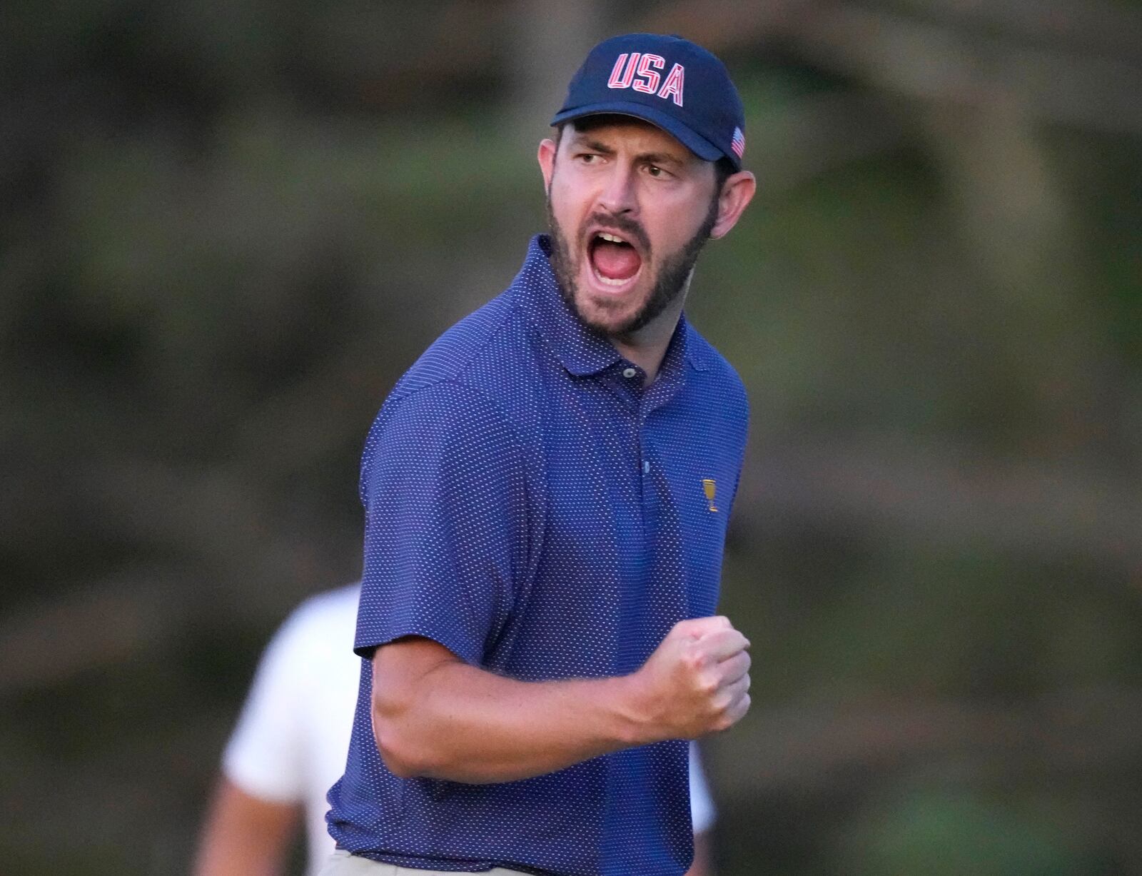 United States team member Patrick Cantlay reacts after making the winning putt on the 18th hole during their fourth round foursomes match at the Presidents Cup golf tournament at Royal Montreal Golf Club Saturday, Sept. 28, 2024 in Montreal. (Frank Gunn/The Canadian Press via AP)