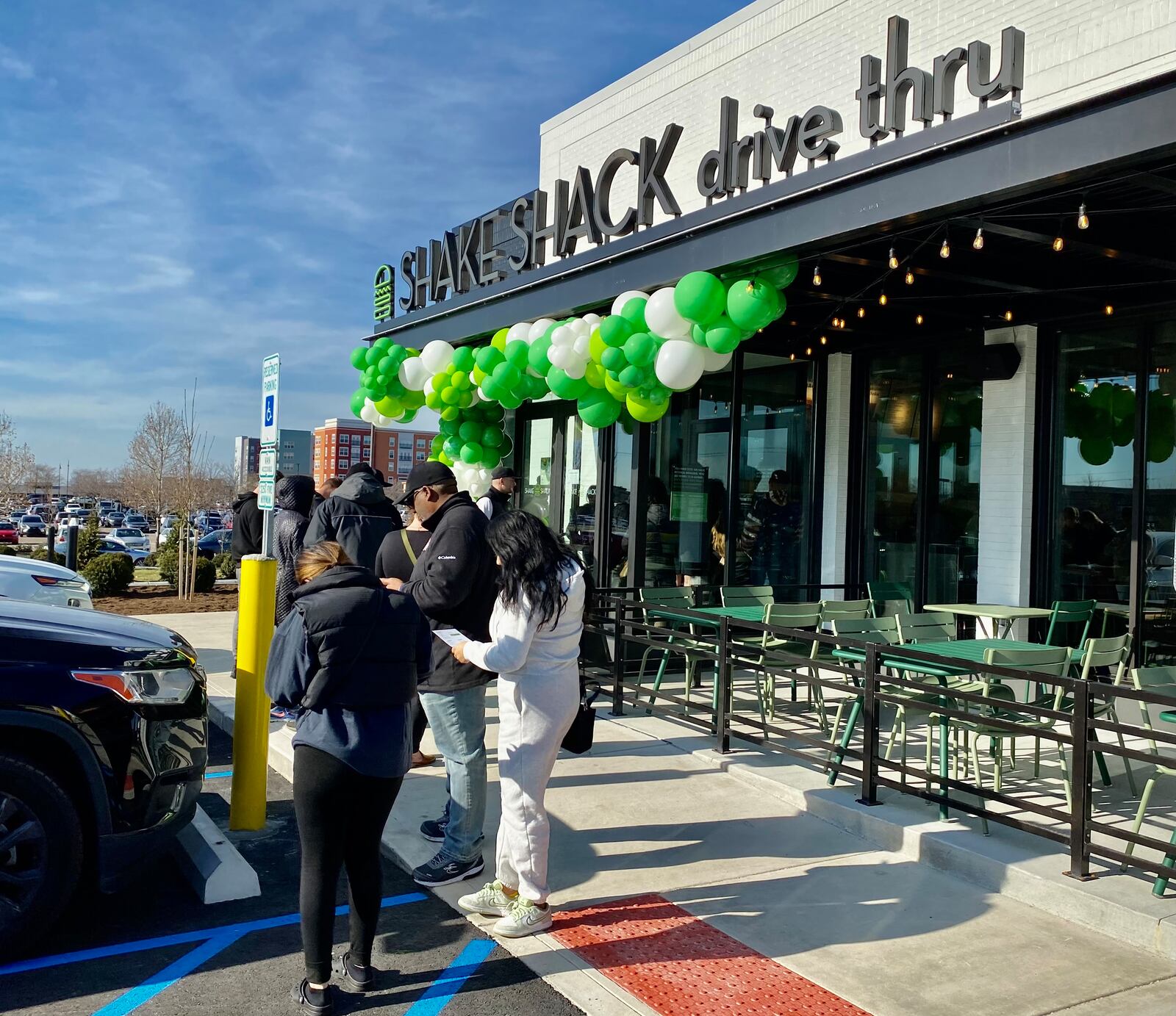 A crowd of patrons visit Shake Shack in Liberty Twp., which opened this week. MICHAEL D. CLARK/CONTRIBUTED