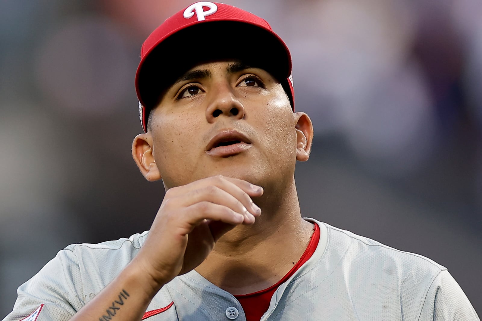 Philadelphia Phillies pitcher Ranger Suárez walks off the field at the end of the second inning of Game 4 of the National League baseball playoff series against the New York Mets, Wednesday, Oct. 9, 2024, in New York. (AP Photo/Adam Hunger)