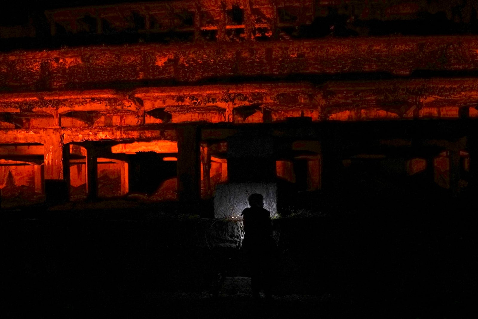 One of the industrial heritages Kitazawa Flotation Plant, a processing gold ore plant, is illuminated in Sado, Niigata prefecture, Japan, Saturday, Nov. 23, 2024. (AP Photo/Eugene Hoshiko)