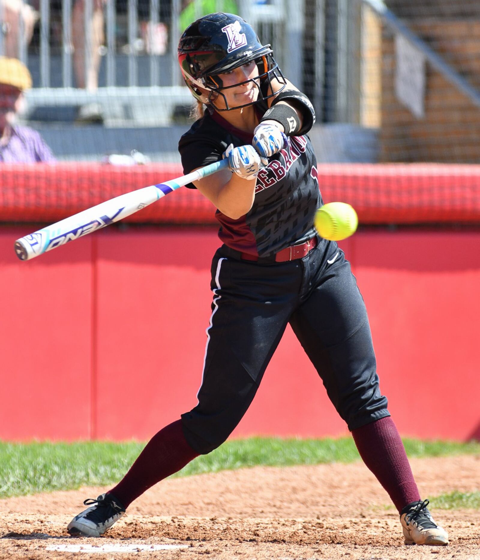 Lebanon catcher Molly Osborne takes a swing during the Division I state final against Elyria on Saturday at Firestone Stadium in Akron. CONTRIBUTED PHOTO BY BRYANT BILLING