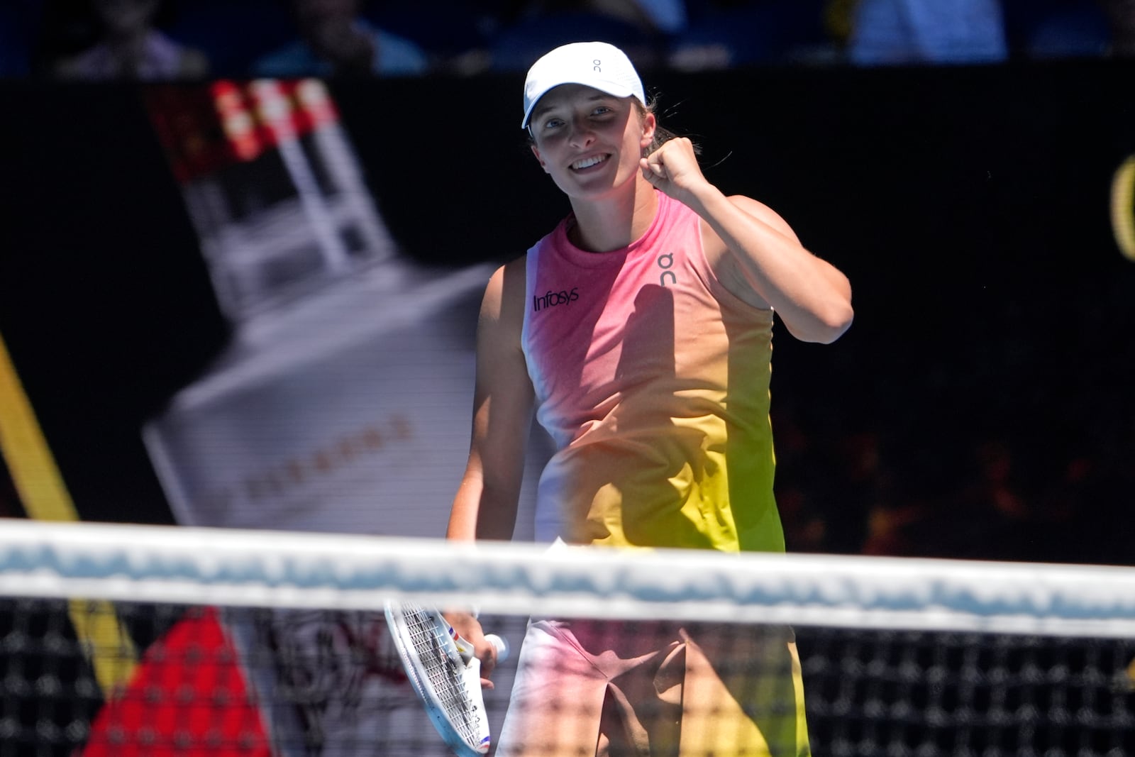 Iga Swiatek of Poland reacts after defeating Emma Raducanu of Britain in their third round match at the Australian Open tennis championship in Melbourne, Australia, Saturday, Jan. 18, 2025. (AP Photo/Asanka Brendon Ratnayake)