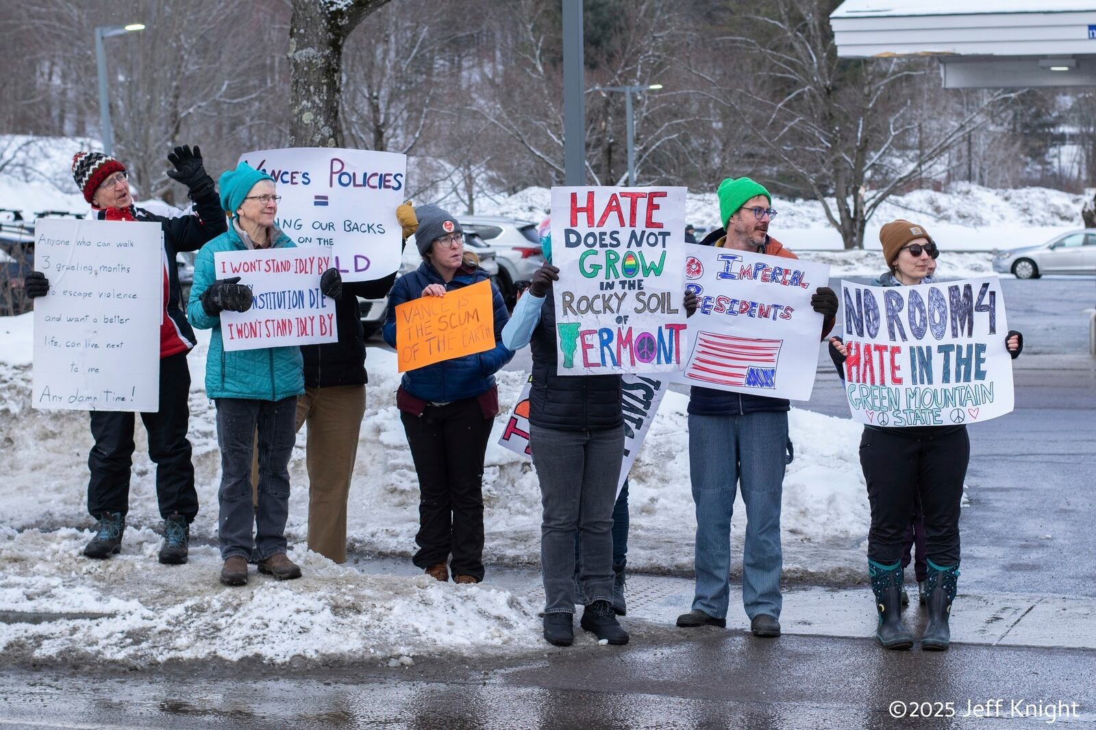 Protesters of Vice President JD Vance stand near Main Street, Rt. 100, in Waitsfield, Vt., Saturday, March 1, 2025. (Jeff Knight/The Valley Reporter via AP)