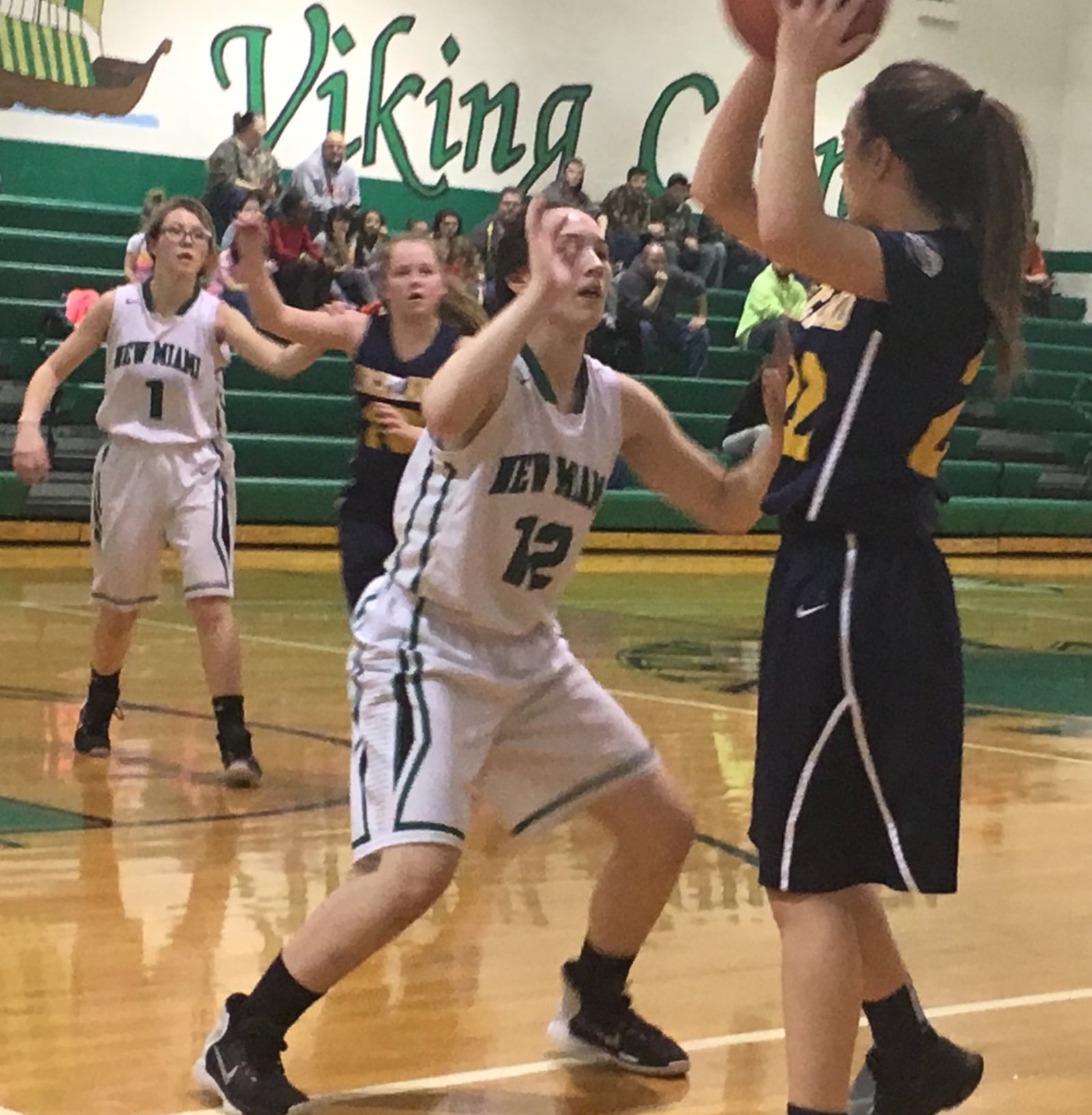 New Miami’s Arielle Scalf (12) applies pressure to Lockland’s Tia Costanzo (22) during Wednesday night’s game at New Miami. RICK CASSANO/STAFF