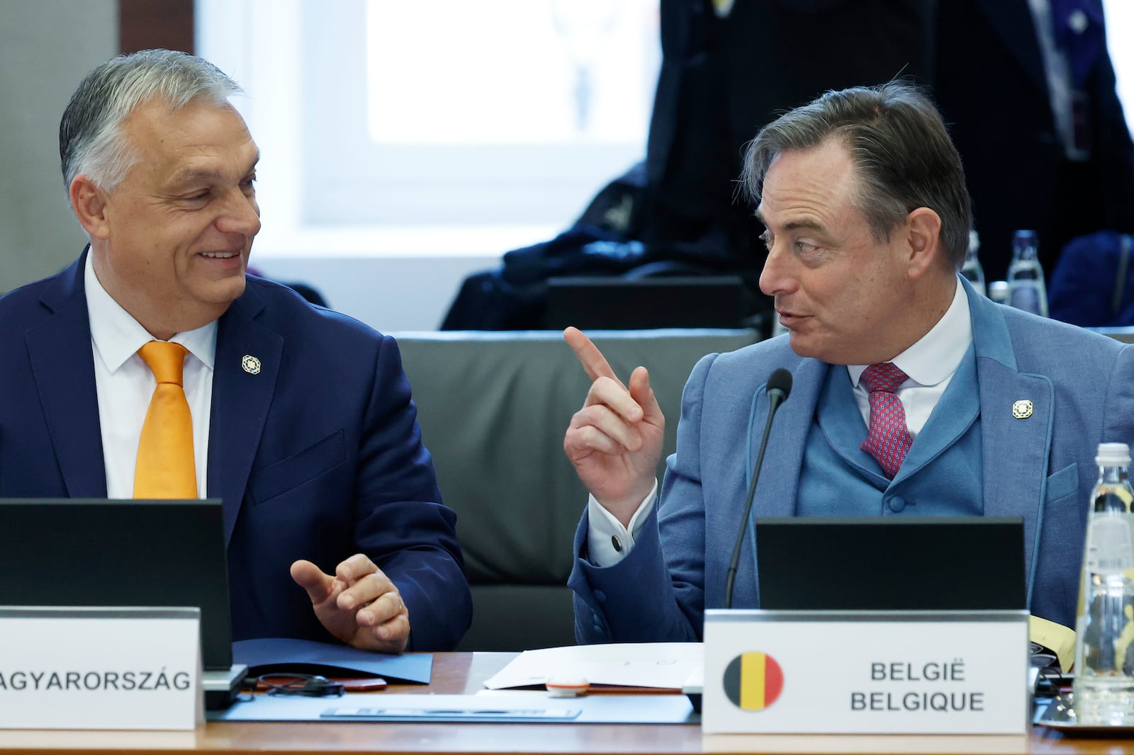 Hungary's Prime Minister Viktor Orban, left, speaks with Belgium's Prime Minister Bart De Wever at a round table meeting during an EU summit in Brussels, Monday, Feb. 3, 2025. (AP Photo/Geert Vanden Wijngaert)