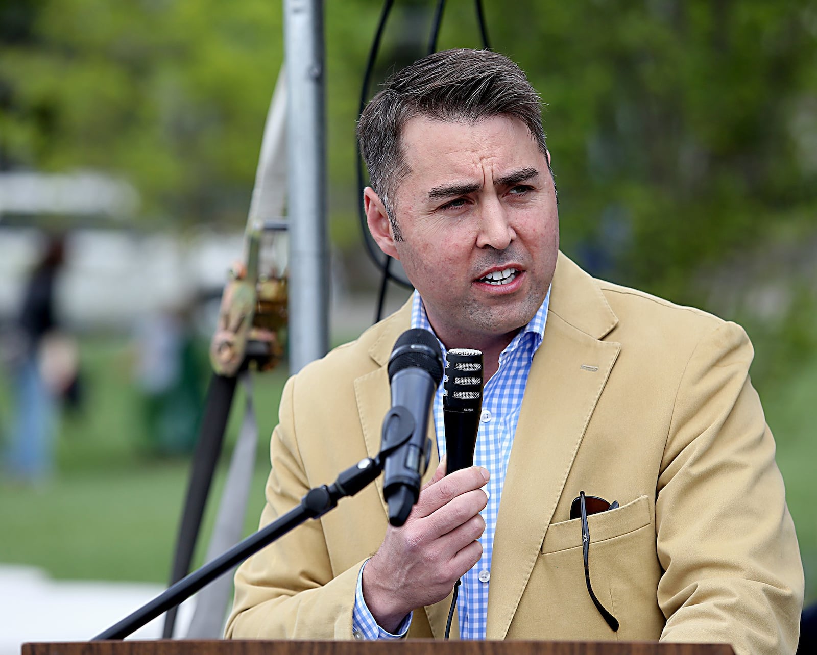 Contributed photo by E.L. Hubbard Hamilton City Manager Joshua Smith speaks during the dedication of Marcum Park in downtown Hamilton Saturday, May 6, 2017.