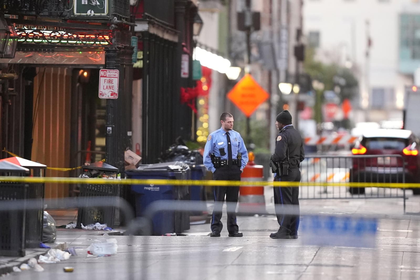 Emergency services attend the scene on Bourbon Street after a vehicle drove into a crowd on New Orleans' Canal and Bourbon Street, Wednesday Jan. 1, 2025. (AP Photo/Gerald Herbert)