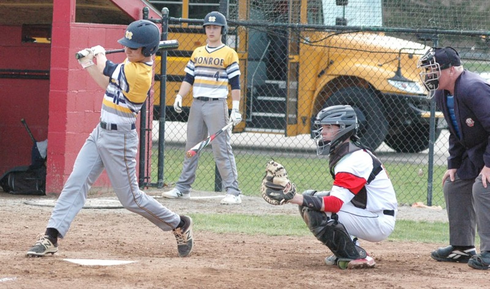 Monroe’s Bryce Giesting (11) takes a cut with Franklin’s Zack Minton behind the plate April 5 during a Southwestern Buckeye League baseball game at Franklin Community Park. Franklin won 5-4. RICK CASSANO/STAFF