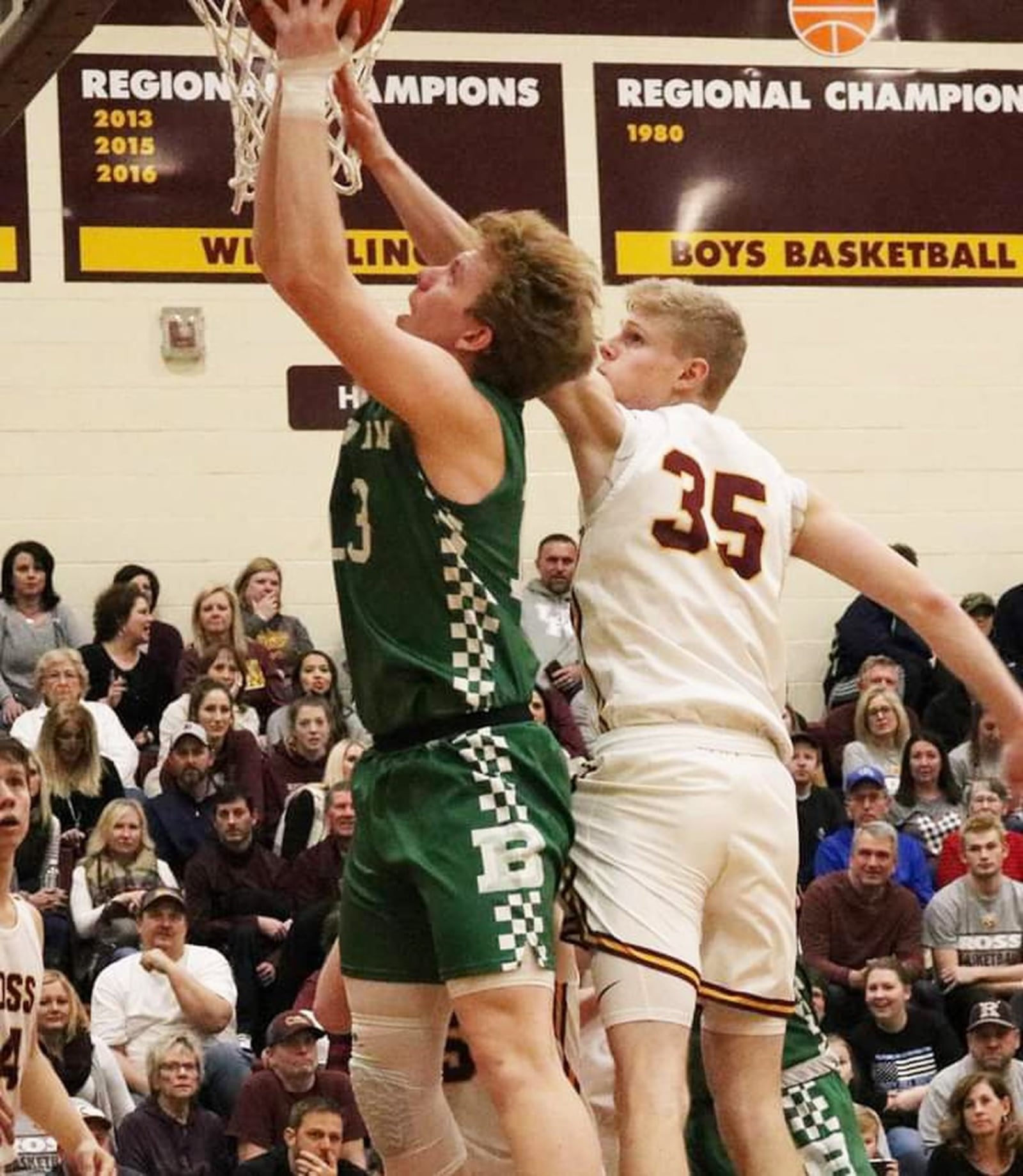 Badin’s Justin Pappas (13) is defended by Cody Geers of Ross (35) during Saturday night’s game at Ross. Badin won 51-38. CONTRIBUTED PHOTO BY TERRI ADAMS