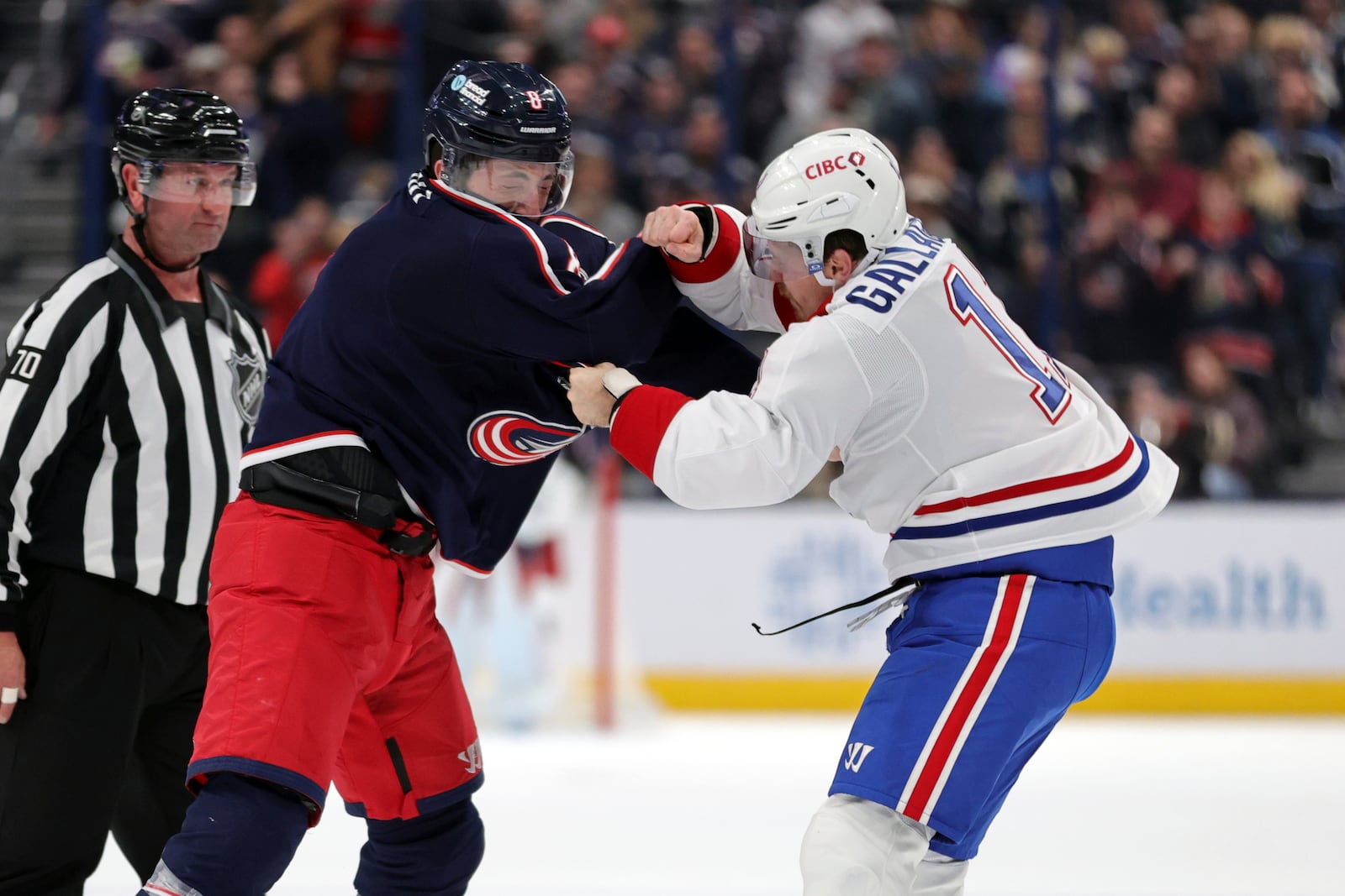 Columbus Blue Jackets defenseman Zach Werenski, left, fights with Montreal Canadiens forward Brendan Gallagher during the second period of an NHL hockey game in Columbus, Ohio, Wednesday, Nov. 27, 2024. (AP Photo/Paul Vernon)