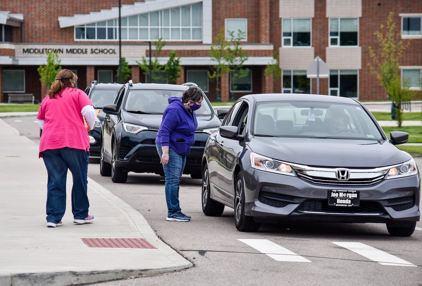 Middletown High School graduates drive up to receive diplomas