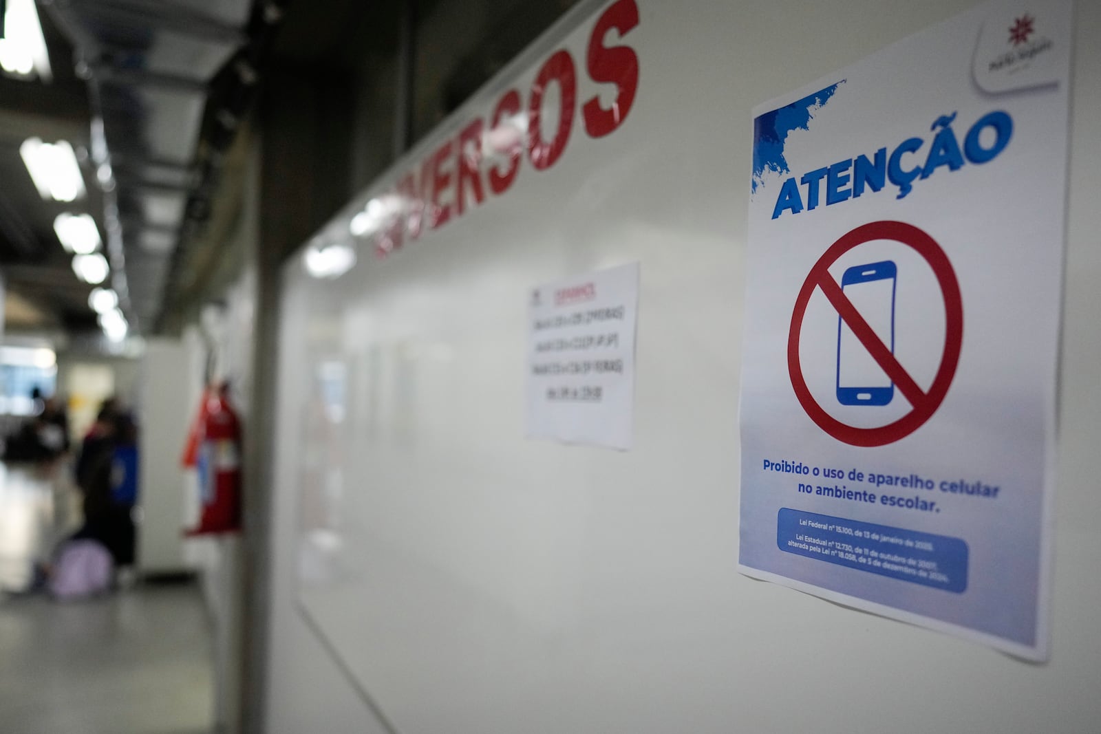 A sign reads in Portuguese " The use of cell phones in the school is prohibited" at Porto Seguro school in Sao Paulo, Thursday, Feb. 6, 2025. (AP Photo/Andre Penner)