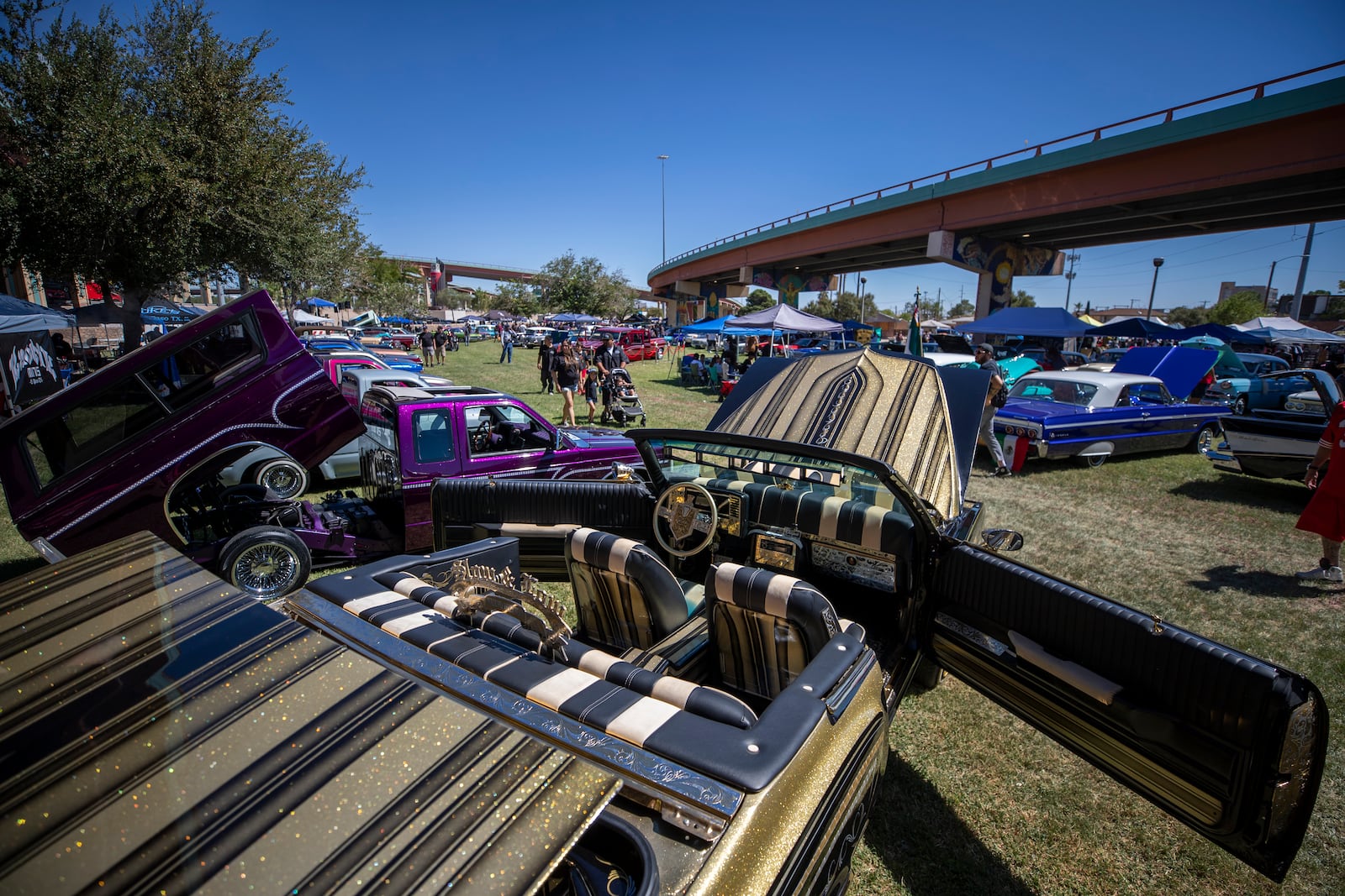 Vintage cars are pictured during a lowrider exhibition for the 20th anniversary of Lincoln Park in El Paso, Texas, Sunday, Sept. 22, 2024. (AP Photo/Andrés Leighton)