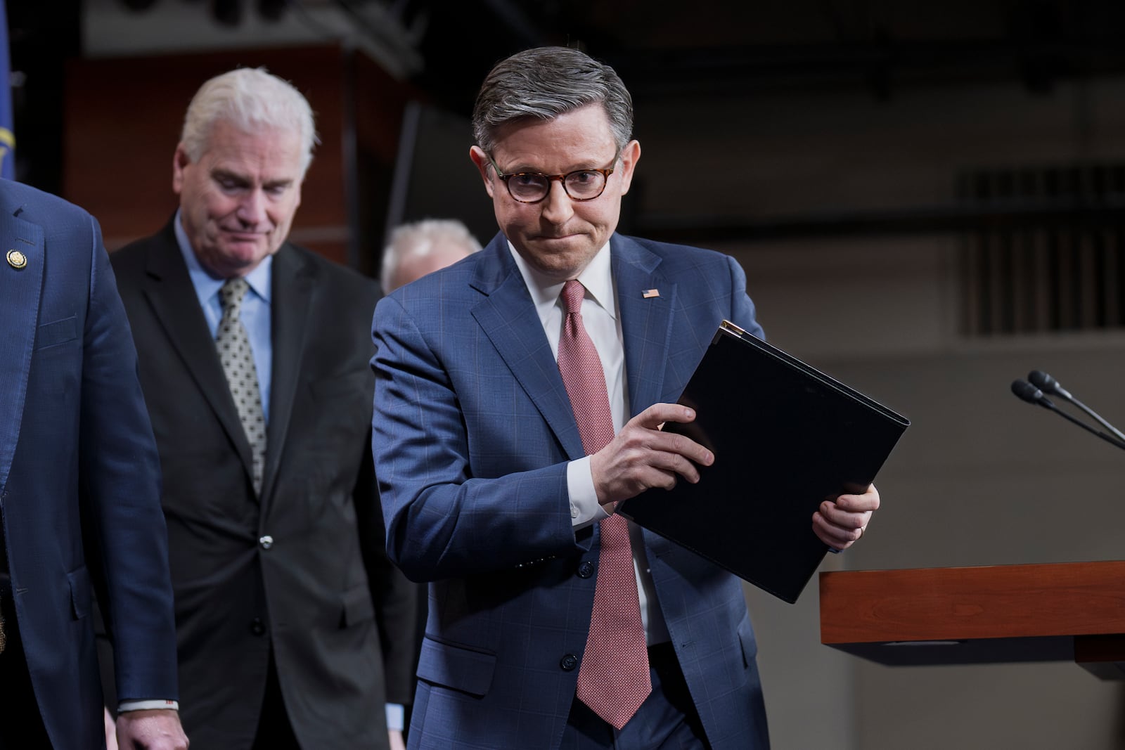 Speaker of the House Mike Johnson, R-La., joined at left by House Majority Whip Tom Emmer, R-Minn., departs after talking to reporters about a spending bill, at the Capitol in Washington, Tuesday, Feb. 11, 2025. (AP Photo/J. Scott Applewhite)