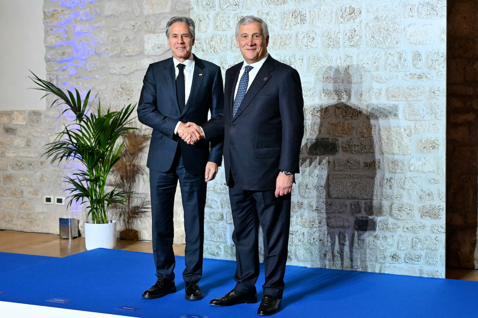 Italy's Foreign Minister Antonio Tajani, right, welcomes US Secretary of State Antony Blinken at the G7 Foreign Ministers meeting in Anagni, central Italy, Monday, Nov. 25, 2024. (Andreas Solaro/Pool Photo via AP)