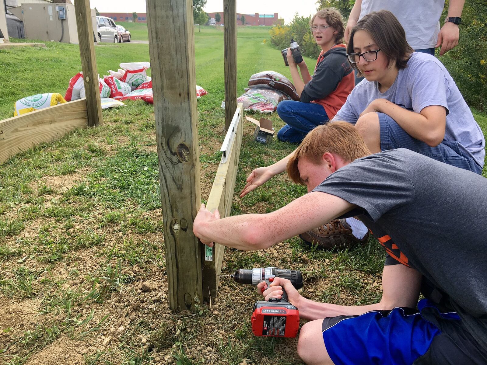 Lakota students from the Edge Teen Center in Liberty Twp. have started construction of the youth center’s first garden. The garden will be planted in early spring and vegetables and herbs harvested will be used to teach teens healthy cook and eating habits. MICHAEL D. CLARK/STAFF