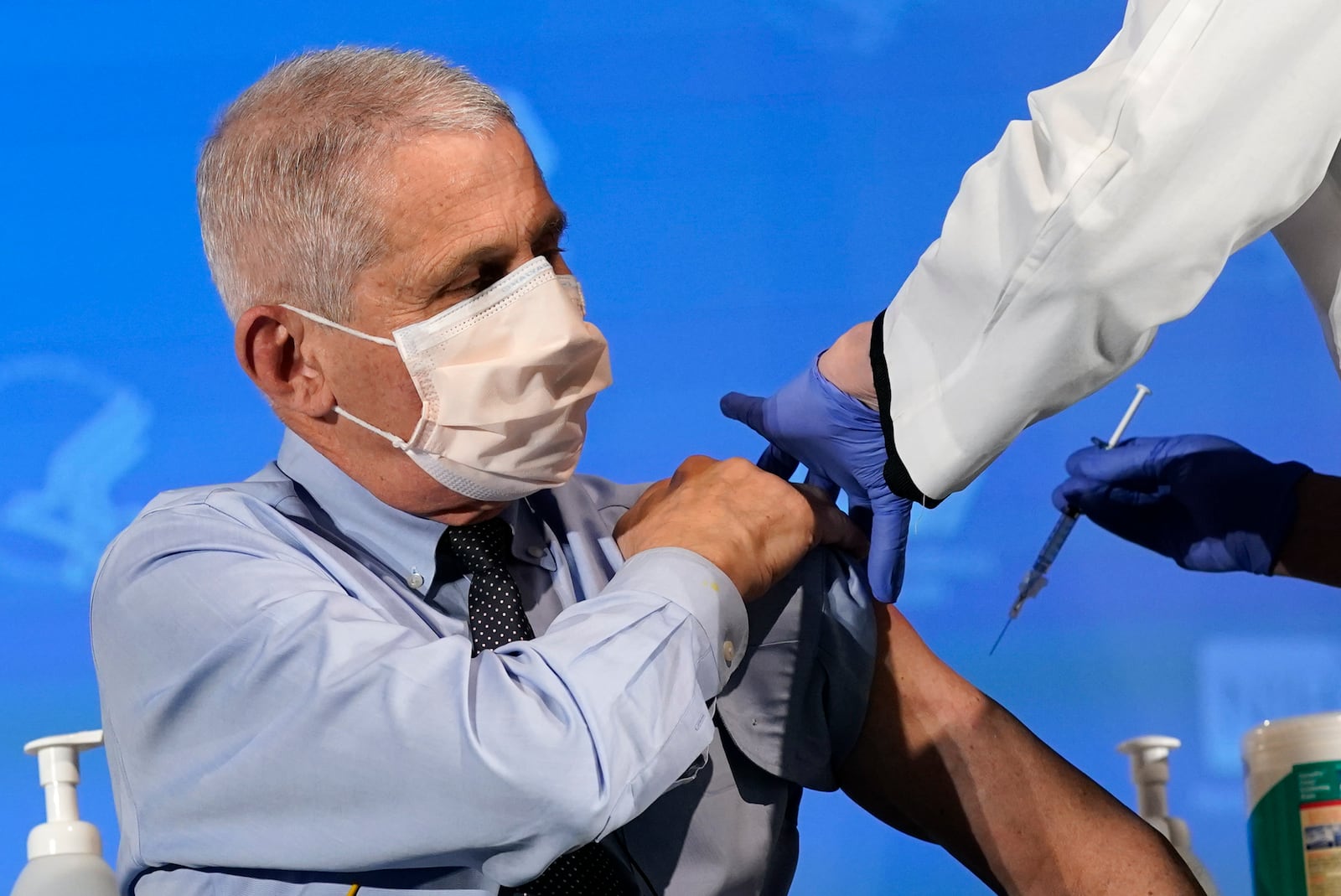 FILE - Dr. Anthony Fauci, director of the National Institute of Allergy and Infectious Diseases, prepares to receive his first dose of the COVID-19 vaccine at the National Institutes of Health, Dec. 22, 2020, in Bethesda, Md. (AP Photo/Patrick Semansky, Pool, File)