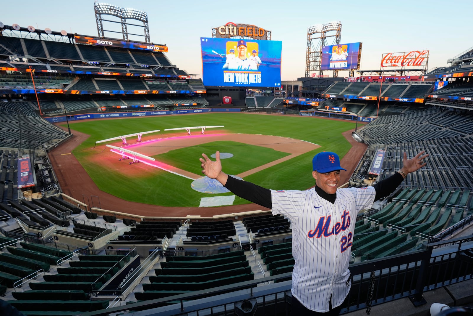 New York Mets' Juan Soto poses for photographs at Citi Field, Thursday, Dec. 12, 2024, in New York. (AP Photo/Frank Franklin II)