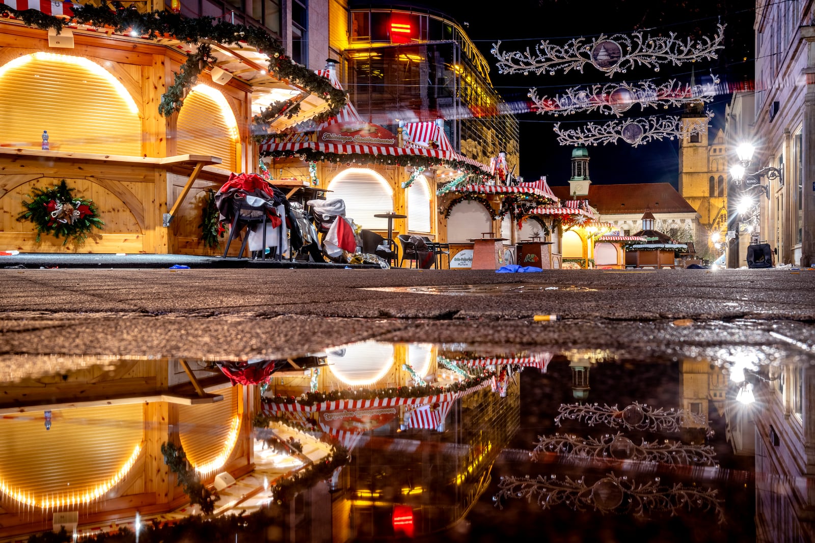 The Christmas market, where a car drove into a crowd on Friday evening, in Magdeburg, Germany, is empty on Sunday morning , Dec. 22, 2024. (AP Photo/Michael Probst)