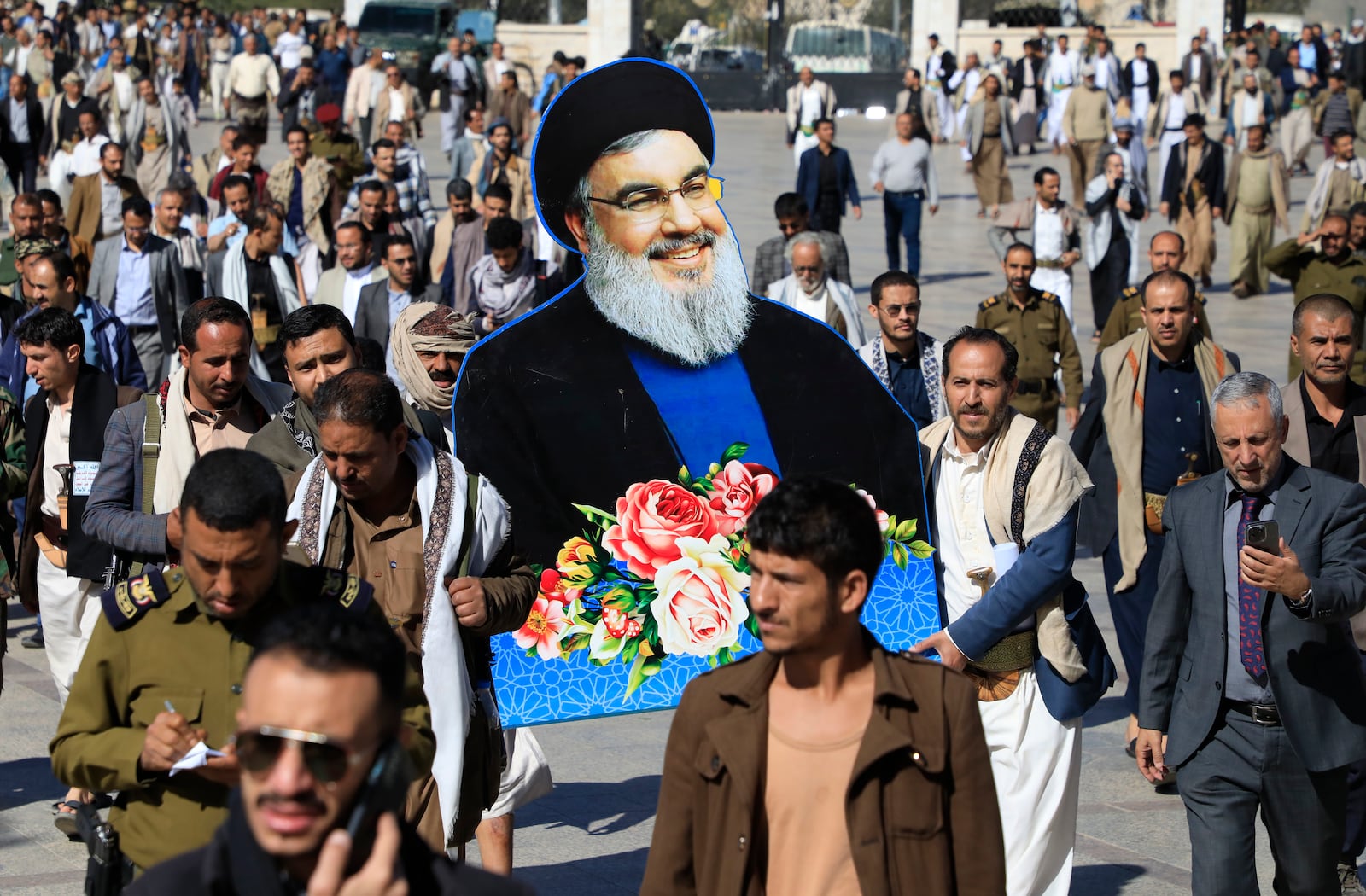 Houthi mourners hold a picture of Lebanon's former Hezbollah leaders, Hassan Nasrallah, during an absent funeral prayers in Sanaa, Yemen, Sunday Feb. 23, 2025. (AP Photo/Osamah Abdulrahman)