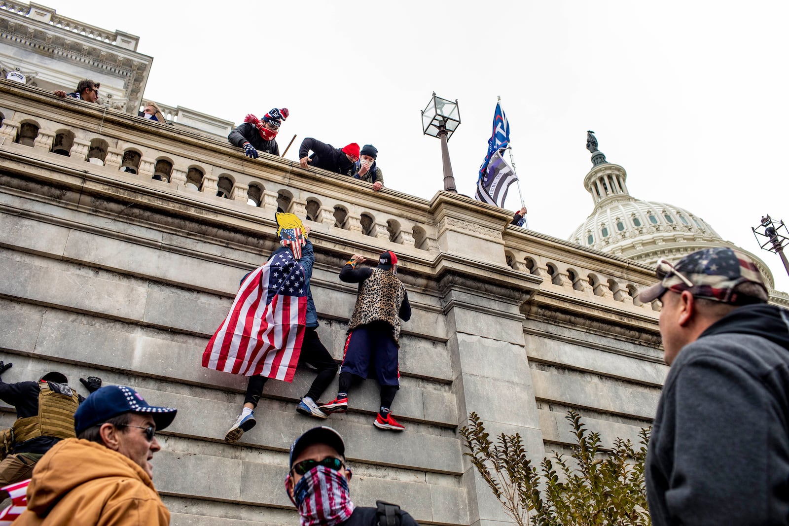 
                        FILE — Protesters storming the U.S. Capitol in Washington, on Jan. 6, 2021. Even Republicans who once said violent rioters should be prosecuted to the fullest extent of the law declined to criticize the presidential clemency for violent offenders, saying it was time to move on. (Jason Andrew/The New York Times)
                      