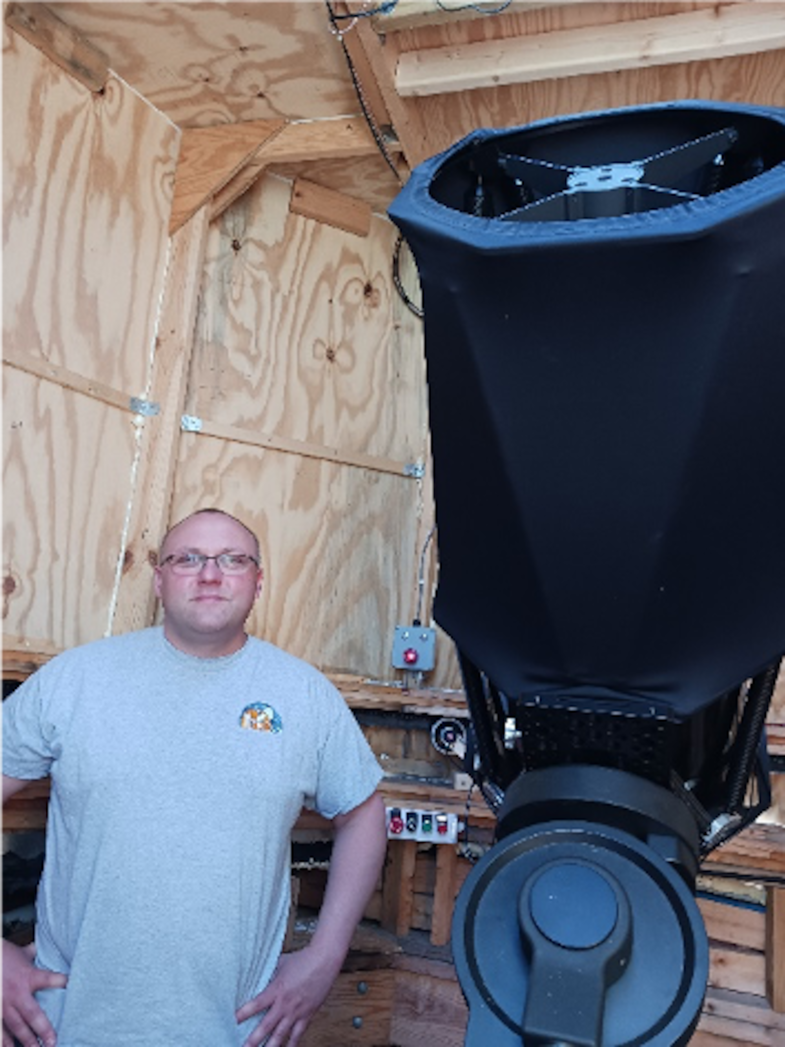 Mike Titus stands next to his telescope. ETHAN BURKE/OXFORD OBSERVER