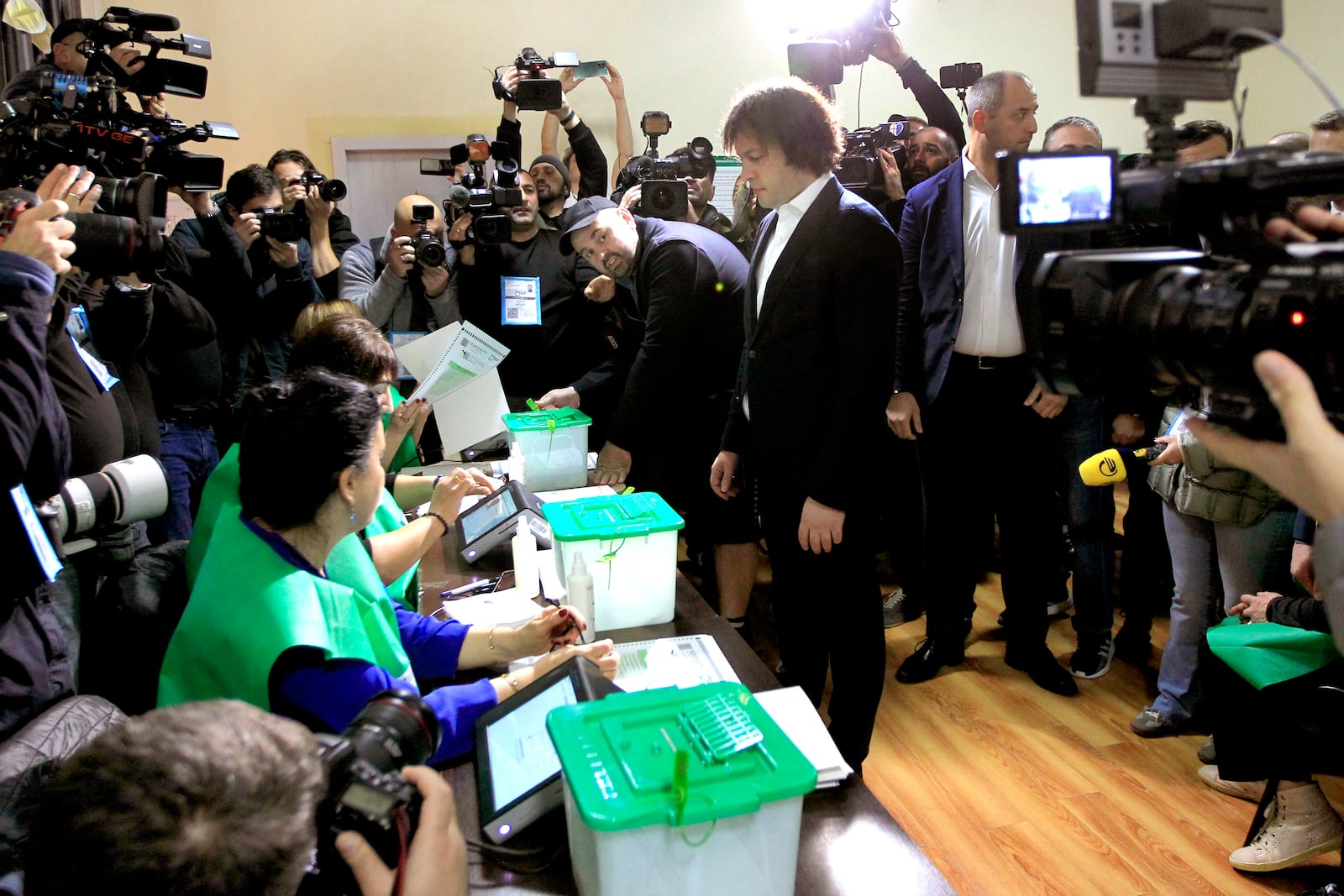 Georgian Prime Minister Irakli Kobakhidze gets his ballot at a polling station during the parliamentary election in Tbilisi, Georgia, Saturday, Oct. 26, 2024. (AP Photo/Shakh Aivazov)